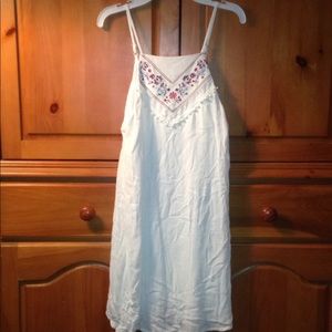 White dress with flowers at the neck line